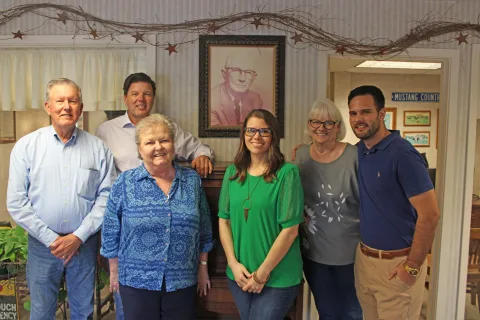 The Stover & Crouch team together in the agency office.